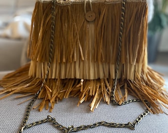 Handmade raffia bag with bamboo handles