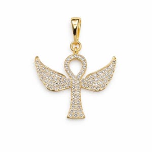 May include: A gold-toned pendant shaped like an ankh with outstretched wings. The entire surface of the ankh and wings is encrusted with small, clear, sparkling stones. A smooth gold-toned bail is attached to the top for hanging on a chain.