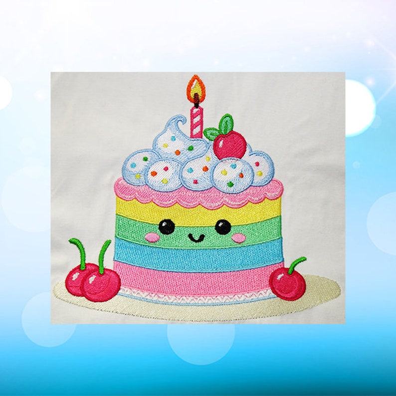 May include: A colorful embroidered cake with a smiling face, a single lit candle, and cherries on top. The cake is decorated with sprinkles and frosting.