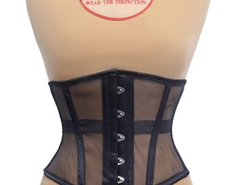 May include: Black mesh corset with satin trim and silver metal busk closures. The corset has a label that reads "Dewan's Corset & Lingerie - Wear the Perfection - "