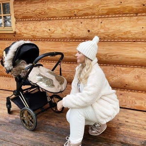 Winterschlafsack für den Kinderwagen Fußsack Winter wasserfest beige gold Flügel