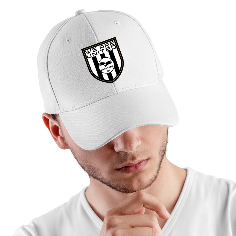 May include: White baseball cap with a black and white logo that says "We Are United" with a black eagle and the words "Warriors 2020" in gold.