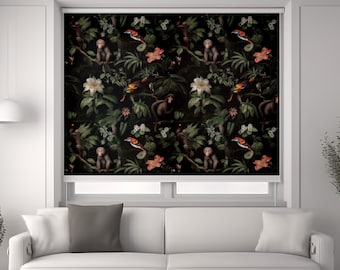 May include: A white sofa with two pillows in front of a window with a black roller shade featuring a repeating pattern of monkeys, birds, and flowers.