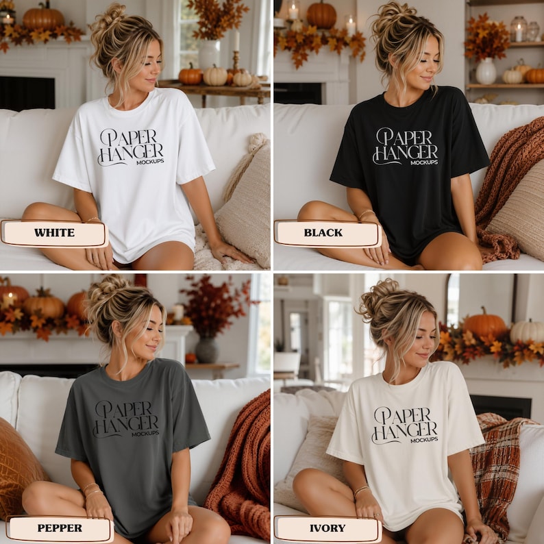 Pode incluir: Uma cole&ccedil;&atilde;o de quatro t-shirts de manga curta em branco, preto, pimenta e marfim. Cada t-shirt apresenta o texto 'PAPER HANGER MOCKUPS' impresso numa fonte estilizada preta ou branca no peito, com gola redonda e corte descontra&iacute;do.