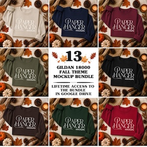 May include: A collection of thirteen Gildan 18000 crewneck sweatshirts in various solid colors, each featuring the white text PAPER HANGER MOCKUPS. The central graphic displays the text 13 GILDAN 18000 FALL THEME MOCKUP BUNDLE.