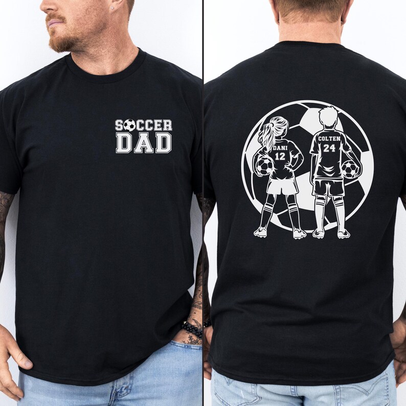 May include: Black t-shirt with the text "SOCCER DAD" in white block letters on the front. The back features a white graphic of two soccer players with the names "DANI 12" and "COLTEN 24" inside a soccer ball.