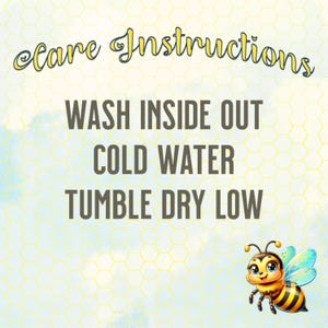 May include: A light blue and yellow background with a honeycomb pattern. The text "Care Instructions" is in a cursive font. Below, the text reads "WASH INSIDE OUT, COLD WATER, TUMBLE DRY LOW." A cartoon bee is in the bottom right corner.