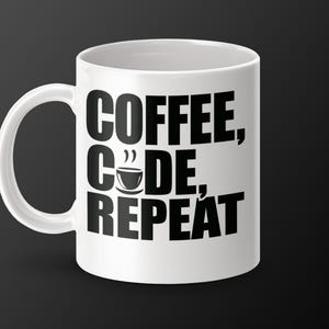 May include: White ceramic coffee mug with black text that reads "Coffee, Code, Repeat" and a small coffee cup icon.