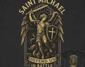 May include: Black t-shirt featuring a gold illustration of Saint Michael, holding a sword and shield, with the text "SAINT MICHAEL" above and "DEFEND US IN BATTLE" below. A smaller image of the design is on the bottom right.