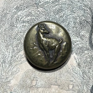 Antique 20th century French hunting button with doe motif.