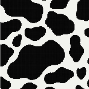May include: Black and white cow print pattern with irregular shaped spots.