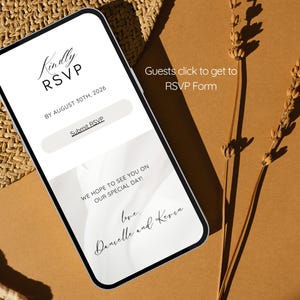 May include: A smartphone screen shows a wedding RSVP form with the text "Kindly RSVP" and "Submit RSVP". The screen also includes the date "August 30th, 2026" and the names "Danielle and Kevin". The phone rests on a textured surface.