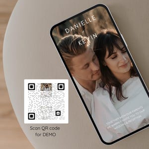 May include: A smartphone screen shows a wedding invitation with the names "DANIELLE" and "KEVIN" in white text. The invitation features a photo of a couple and the text "TOGETHER WITH OUR PARENTS WE WARMLY INVITE YOU TO OUR WEDDING & RECEPTION." A QR code is also visible.