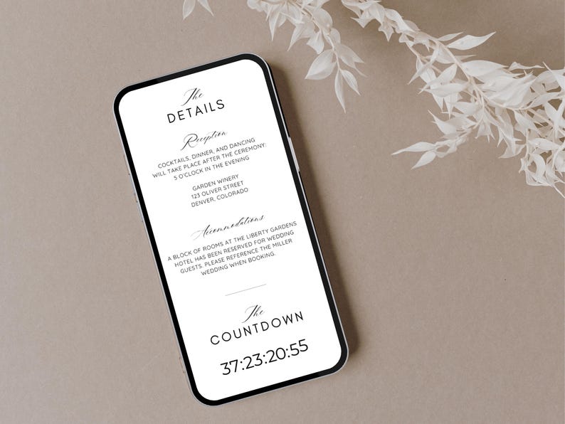 May include: A smartphone screen displays wedding information, including reception details and a countdown timer. The phone is set against a neutral backdrop, with decorative white floral elements. The text includes "The DETAILS".