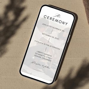 May include: A smartphone screen shows a wedding invitation with the words "The Ceremony." The invitation details the date, time, and location: September 28, 2026, at 4 o'clock in the afternoon, at Liberty Gardens, 123 Annette Street, Denver, Colorado.