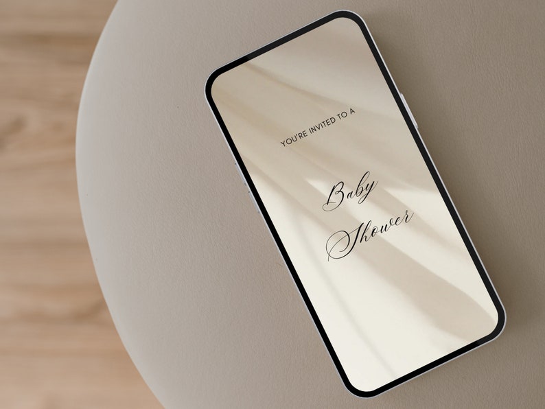 May include: A smartphone displaying a digital invitation to a baby shower. The invitation reads "You're invited to a Baby Shower".