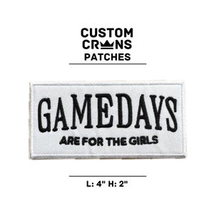 May include: White embroidered patch with black text that reads "GAMEDAYS ARE FOR THE GIRLS". The patch is 4 inches wide and 2 inches tall.
