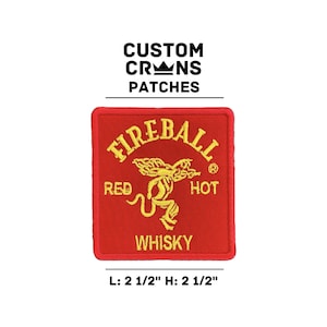 May include: Red and yellow embroidered patch with the words "FIREBALL" and "WHISKY" and a red devil with wings. The patch is 2 1/2 inches wide and 2 1/2 inches tall.