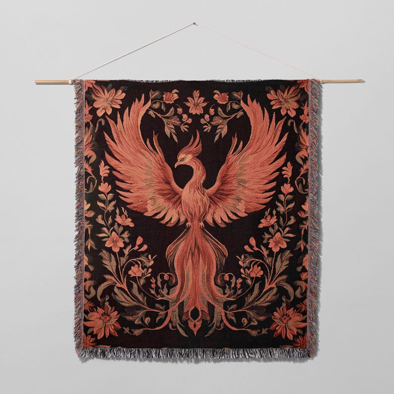May include: A woven tapestry featuring a red phoenix with outstretched wings against a black background. The phoenix is surrounded by intricate floral designs in shades of brown and red.