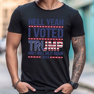 May include: Black t-shirt with a white and blue American flag design. The text "HELL YEAH I VOTED TRUMP AND I WILL DO IT AGAIN 2024" is printed on the shirt.