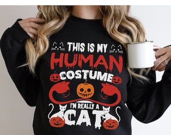 Bluza z nadrukiem „To mój człowiek”: Halloweenowe klimaty dla miłośników kotów
