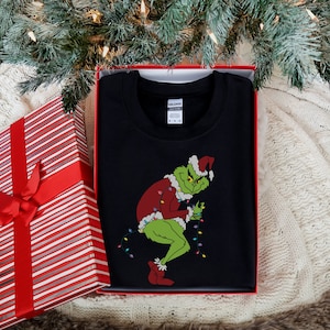 Grinch kradnący świąteczne światła Bluza, prezent dla miłośników Grincha, świąteczny sweter Grincha, świąteczny sweter, odzież w duchu Bożego Narodzenia