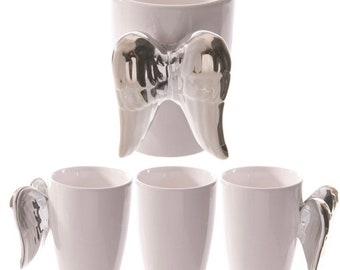 Taza con asa en forma de cerámica con alas de ángel plateadas
