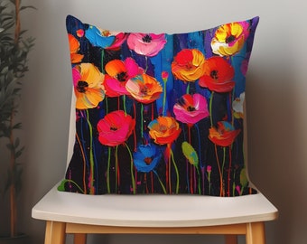 May include: A colorful throw pillow with a floral design featuring bright red, orange, yellow, blue, and pink poppies on a black background.