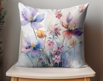 May include: A watercolor pillow cover featuring a bouquet of purple, pink, and yellow flowers on a white background.