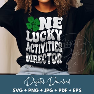 May include: Black sweatshirt with the text "ONE LUCKY ACTIVITIES DIRECTOR" in white, with a green shamrock. The words "Digital Download" are below the sweatshirt, with file type options: SVG, PNG, JPG, PDF, and EPS.