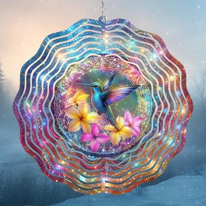 May include: A colorful metal wind spinner with a hummingbird and flowers in the center. The spinner has multiple layers of swirling metal with a rainbow iridescent finish.