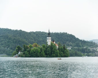 Lake Bled, Slovenia, Bled Lake, The Assumption of Mary Church with a boat at the lake in front of it  - Museum-Quality Matte Paper Poster
