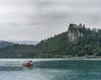 Lake Bled, Slovenia, Bled Lake, Bled Castle at the rock at rainy day with a boat at the lake  - Museum-Quality Matte Paper Poster, lake view