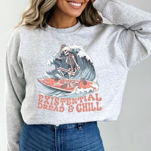 Existential dread surfing skeleton sweatshirt, existential crisis crewneck, dark humor sweatshirt, gift for skeleton lover, surfing sweater