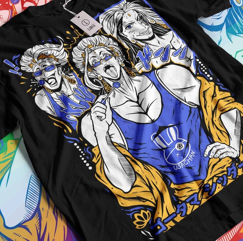 May include: Black t-shirt with a graphic print of three cartoon characters with white hair. The characters are wearing colorful clothing and have exaggerated features. The text "USACHAN" is printed on the shirt. The shirt is a large size.