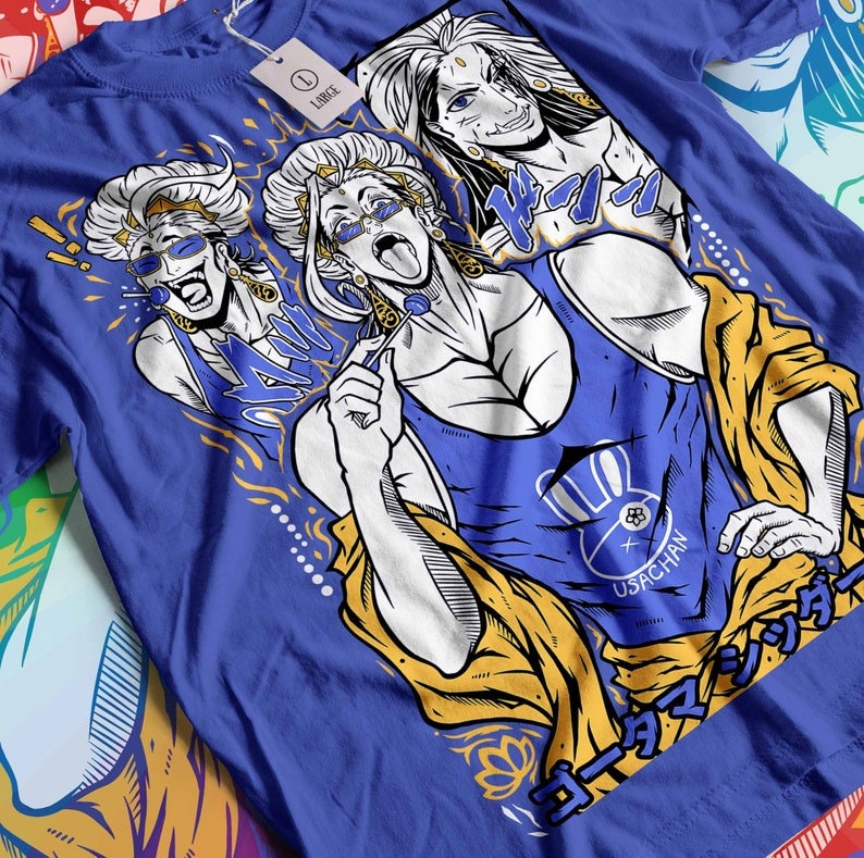 May include: A blue t-shirt with a white graphic print of three figures with long blonde hair. The figures are wearing sunglasses and have a yellow and gold background. The text "USAGCHAN" is printed on the shirt.