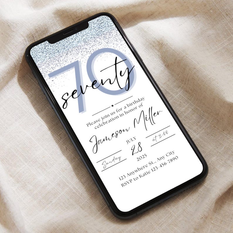 May include: A smartphone displays a digital birthday invitation. The invitation features the word "seventy" in a script font, with the number 70 in a light blue color. The invitation includes the name Jameson Miller, date, time, and RSVP information.