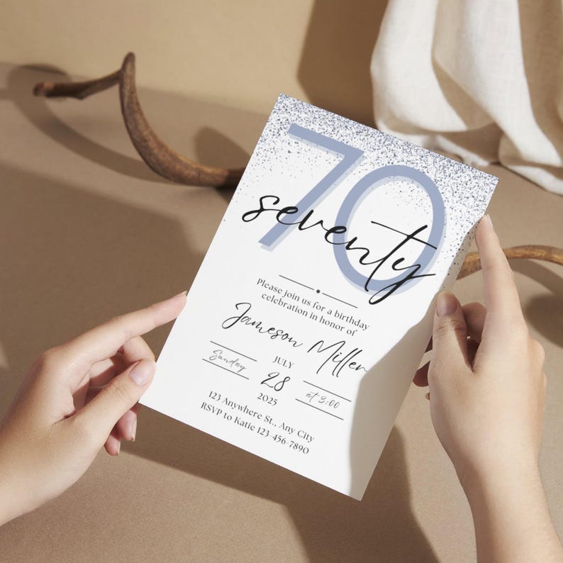 May include: A white invitation card with the number 70 in light blue and silver glitter, with the word "seventy" in cursive. The card includes details for a birthday celebration, including the name Jameson Miller, date, time, and RSVP information.