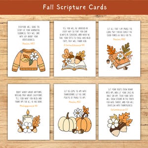 May include: Set of six fall-themed scripture cards. Each card features a different Bible verse with illustrations of pumpkins, acorns, leaves, and a sweater. The cards are printed on white cardstock with a warm, autumnal color palette.