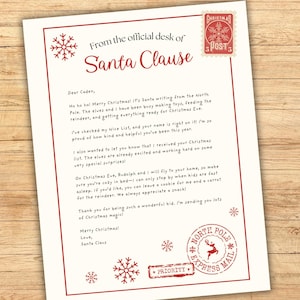 May include: A letter from Santa Claus on cream-colored paper with a red border. The letterhead reads "From the official desk of Santa Claus." Includes a Christmas Post stamp and a North Pole Express Mail stamp.