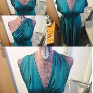 May include: A teal floor-length dress displayed on a mannequin, featuring a versatile wrap-style bodice with multiple styling options including cap sleeves, a one-shoulder drape, and a deep V-neckline, all crafted from a smooth, solid-colored fabric.