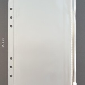 May include: Clear plastic zippered pouch with six holes along the left side for a binder. The pouch measures 14.8 inches by 20.6 inches.