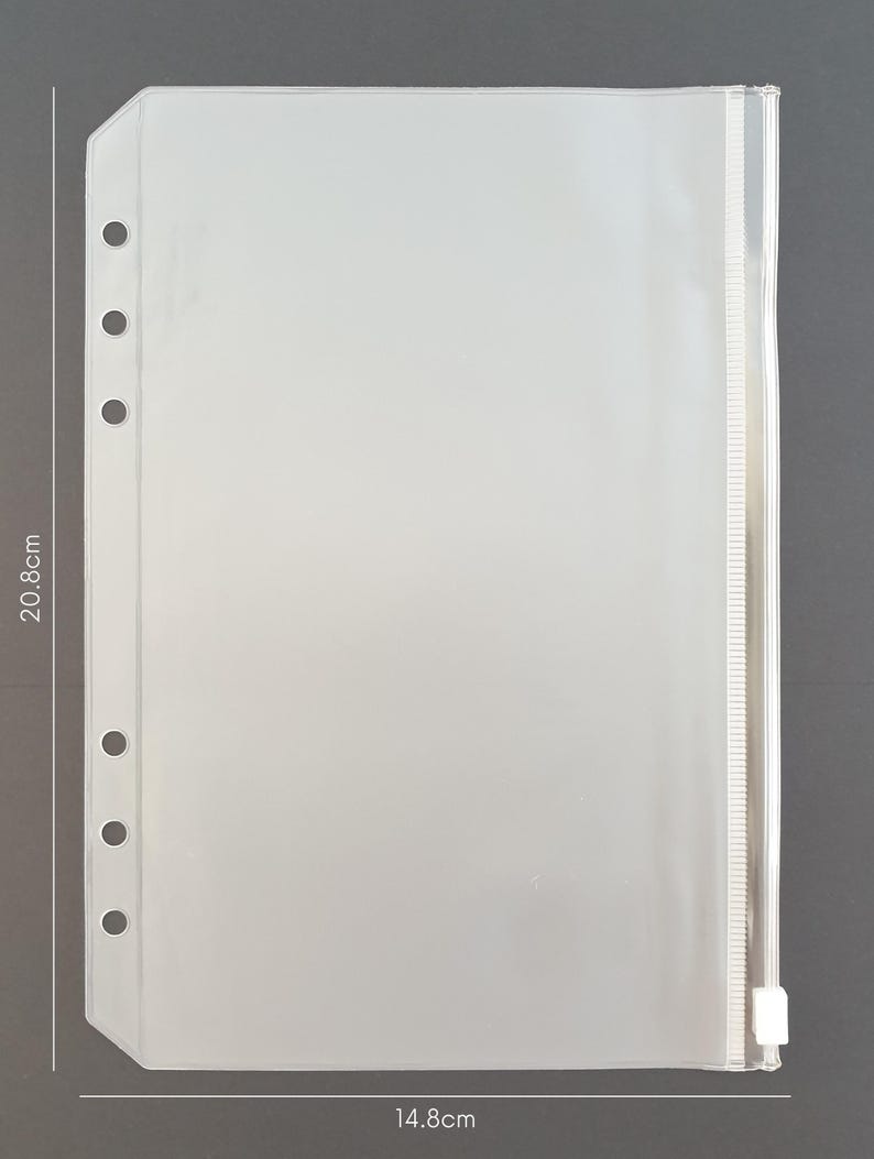 May include: Clear plastic zippered pouch with six holes along the left side for a binder. The pouch measures 14.8 inches by 20.6 inches.