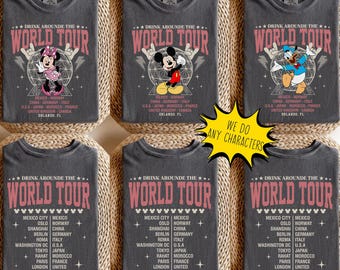 May include: Six gray t-shirts with a "World Tour" design featuring various Disney characters. The shirts include the text "Drink Around the World Tour" and a list of cities. A yellow sign says "We do any characters."