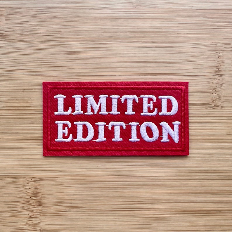 May include: Red fabric patch with white embroidered text that reads "LIMITED EDITION".