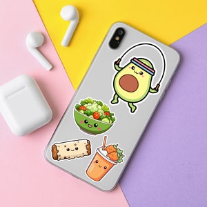 May include: A collection of colorful stickers on a phone case, featuring cute food and fitness-themed illustrations. Includes an avocado jumping rope, a salad bowl, a burrito, and a smoothie. White wireless earbuds and charging case are also visible.