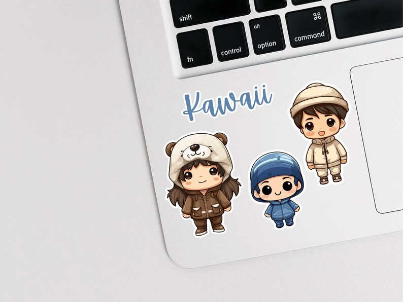 May include: Three cartoon characters wearing winter hats and coats. The characters are a girl wearing a brown coat and a white bear hat, a boy wearing a blue coat and a blue hat, and a boy wearing a white coat and a white hat. The text "Kawaii" is written in blue letters on a white background.