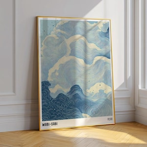 May include: A framed print featuring an abstract design of swirling clouds in shades of blue and white. The print is labelled "WABI-SABI" at the bottom left and "侘寂" at the bottom right.
