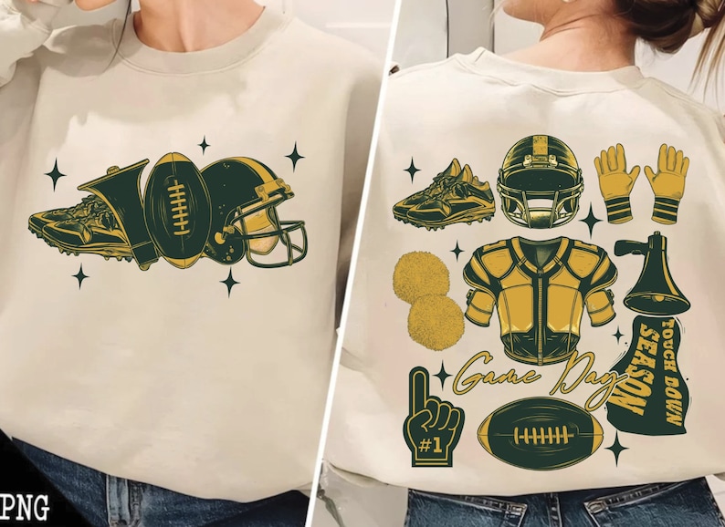 May include: A white sweatshirt with a green and gold football design on the front. The design includes a football, a helmet, a shoe, and a whistle. The back of the sweatshirt has a green and gold design with a football, a helmet, a shoe, a cheerleader's pom-pom, a football jersey, a megaphone, and a hand with a number one finger raised. The text "Game Day" and "Touch Down Season" are also included in the design.