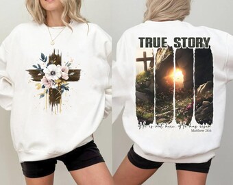 May include: White sweatshirt with a floral cross design on the front and the text "TRUE STORY. He is not here. He has risen. Matthew 28:6" on the back.